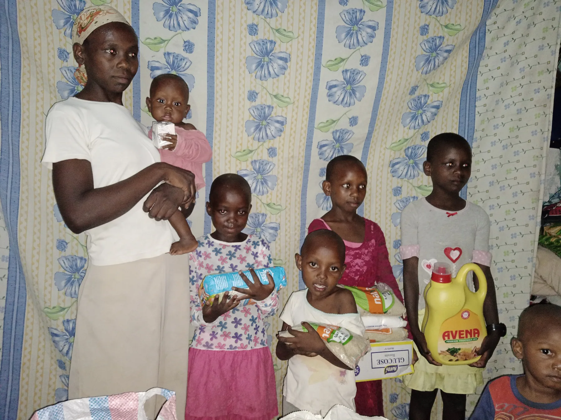 Providing food items to a needy family during Christmas festive season.