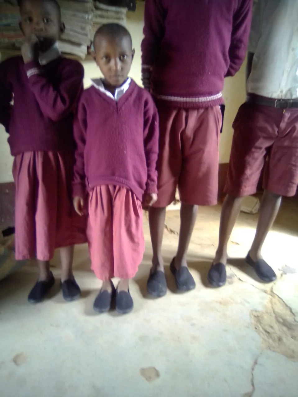 Providing shoes to the needy students in Ngiluni Comprehensive School.