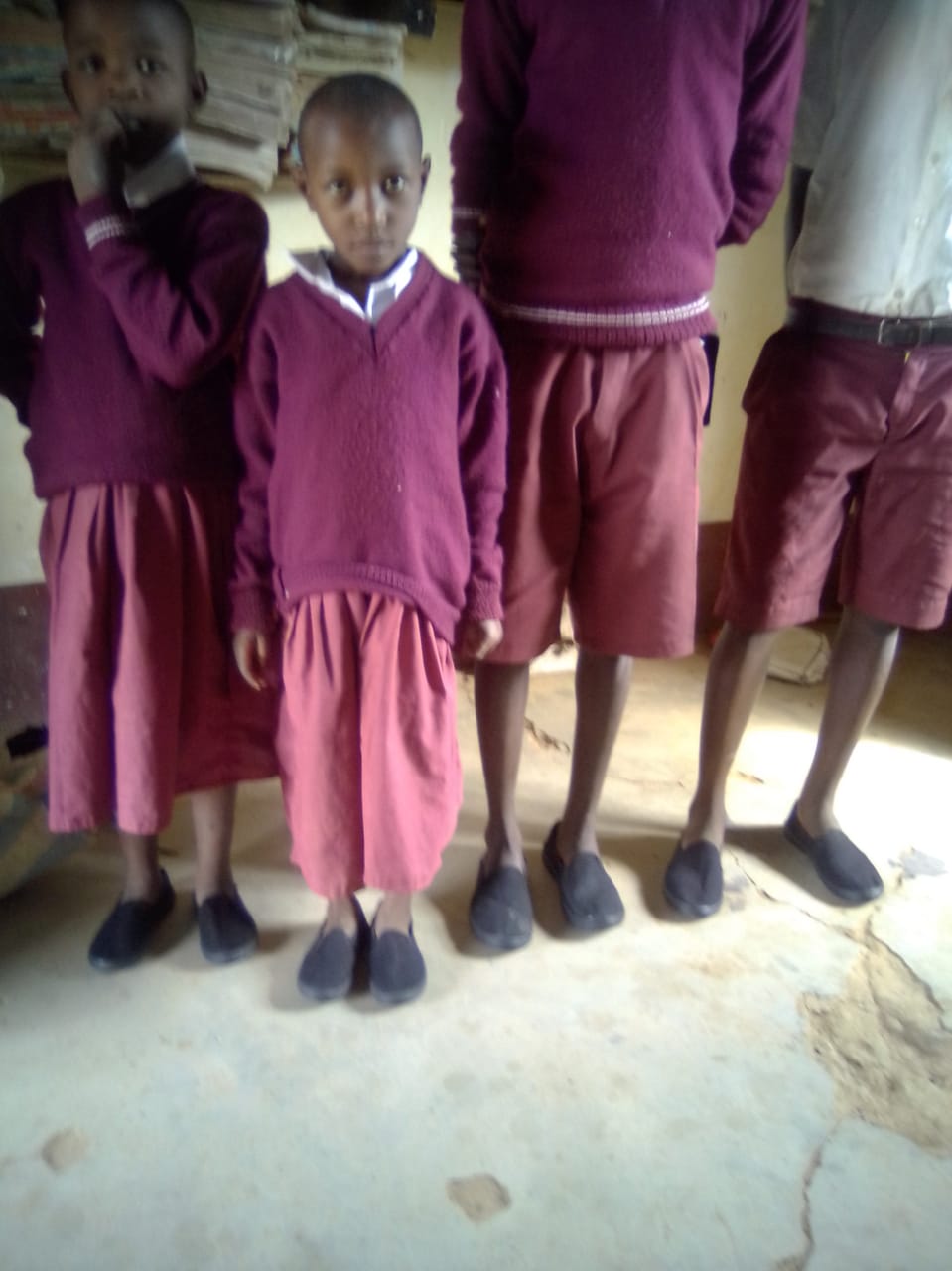 Providing shoes to the needy students in Ngiluni Comprehensive School. 