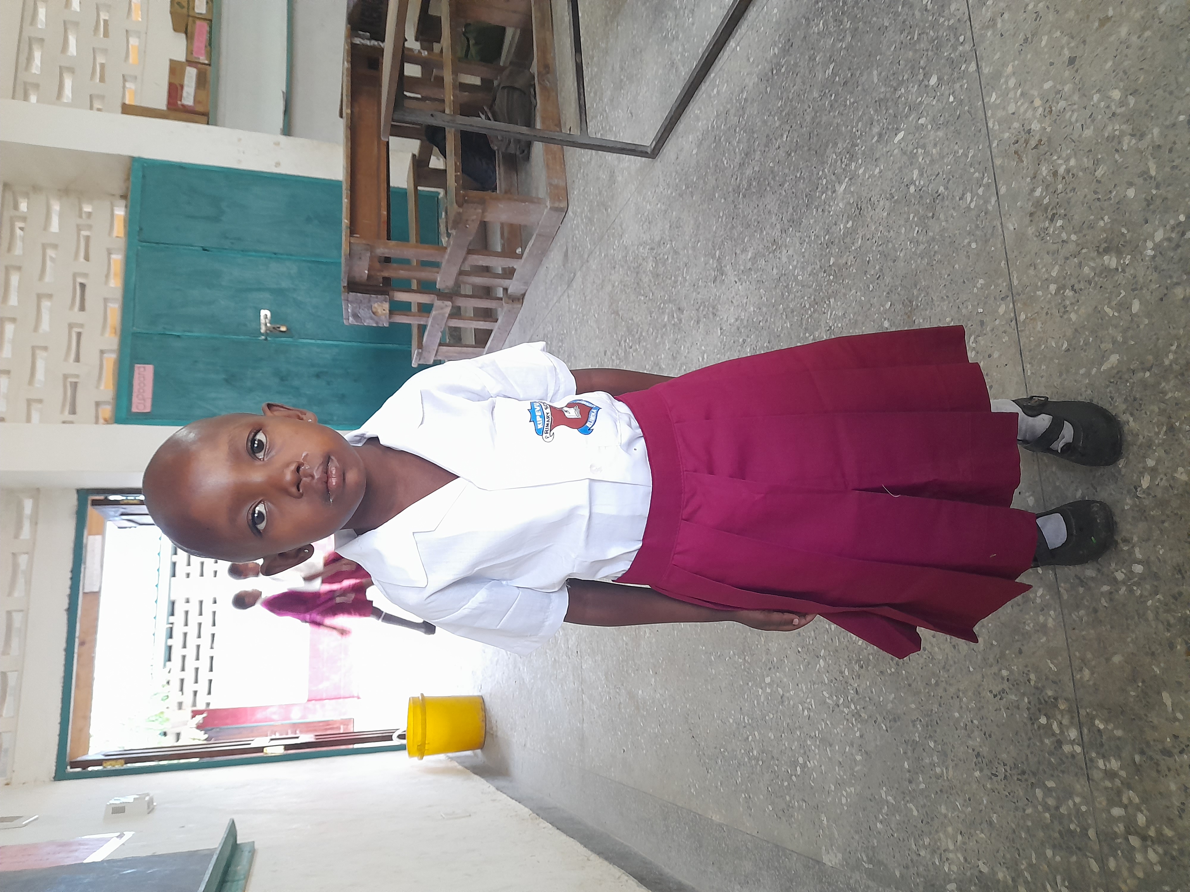 FRADAKI also supported a needy student in Mombasa county by purchasing for the student new neat scholol uniform.